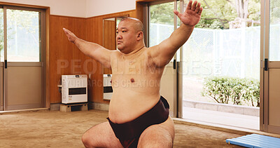 Buy stock photo Athlete, training and exercise for sumo, wrestler and fitness with preparation, skill and technique in ring. Japanese man, fighter and sports in dohyo for culture, workout and wrestling with warm up