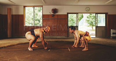 Buy stock photo Japanese men, sumo wrestling and sport for fight, tradition and culture in dohyo ring. People, wrestlers and training for martial arts competition, combat performance and exercise for fitness