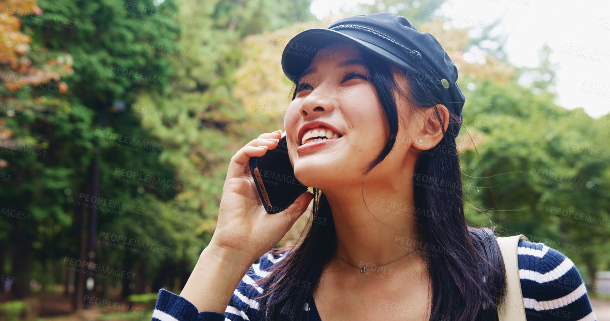 Buy stock photo Happy, asian woman and nature with phone call for travel, sightseeing or communication at park. Japan, female person or tourist with smile on mobile smartphone for conversation, destination or chat