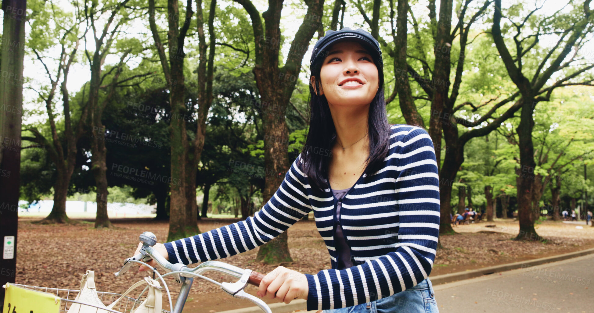 Buy stock photo Park, woman and happy for walking with bicycle for travel, transportation and carbon footprint in Japan. Outdoor, female person and smile at forest on break with bike for self care and relax