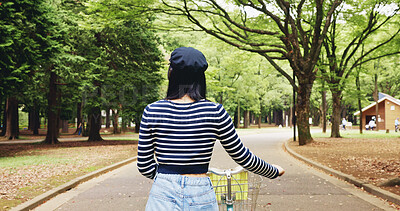 Buy stock photo Travel, back and person with bicycle, park and adventure for tourist, commuting and exploring of nature. Outdoor, student and tourism of environment, traveller and scenery of destination in Japan