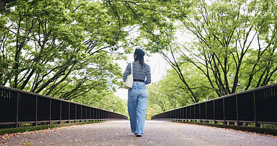 Buy stock photo Walking, back and person on vacation, bridge and adventure for tourist, commuting and exploring of Tokyo. Outdoor, student and tourism of environment, travel and scenery of destination in Japan