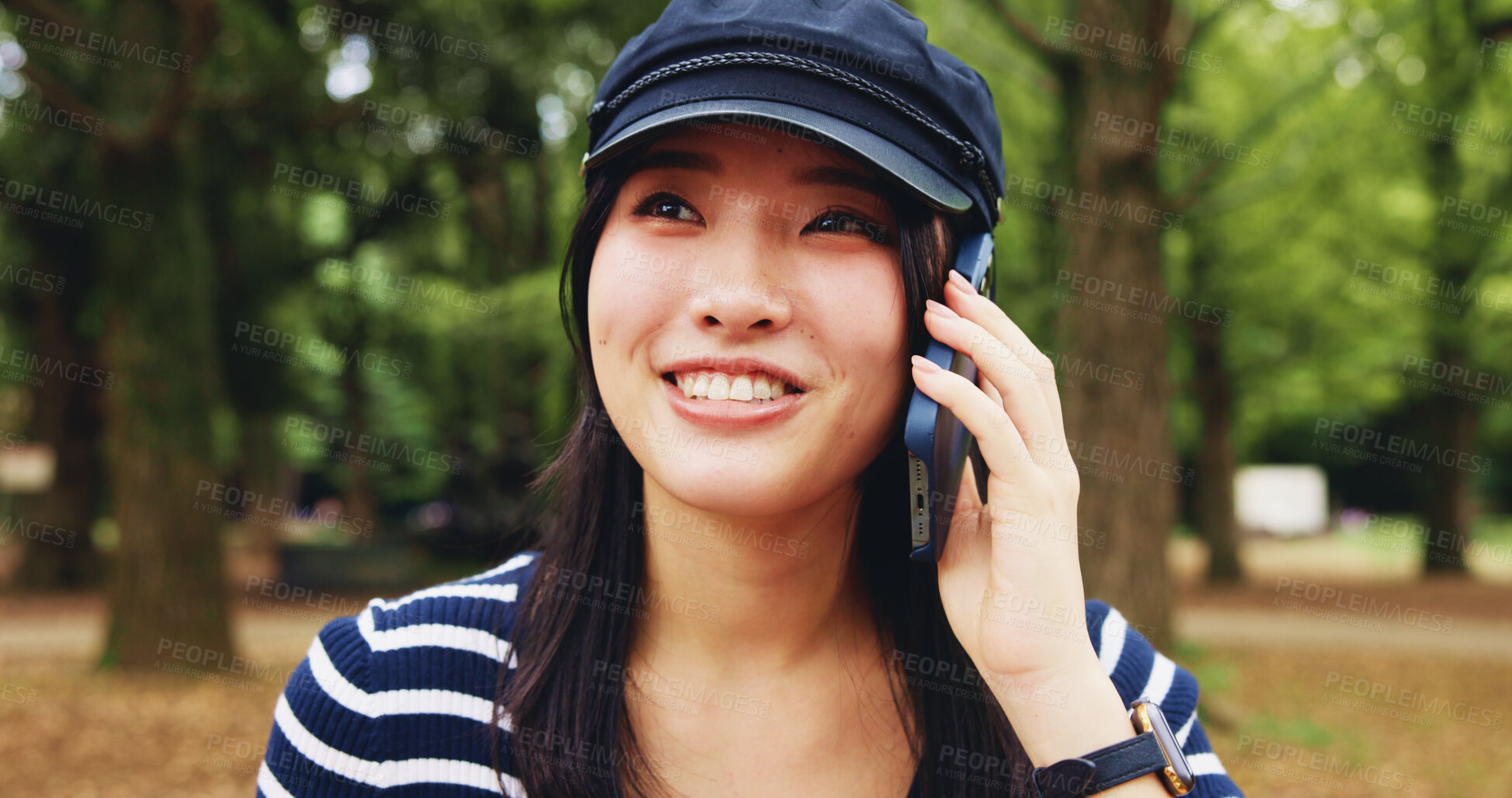 Buy stock photo Park, woman and happy with conversation on phone call for communication, contact and gossip in Japan. Outdoor, female person and smile at forest with listening for update, connection and discussion