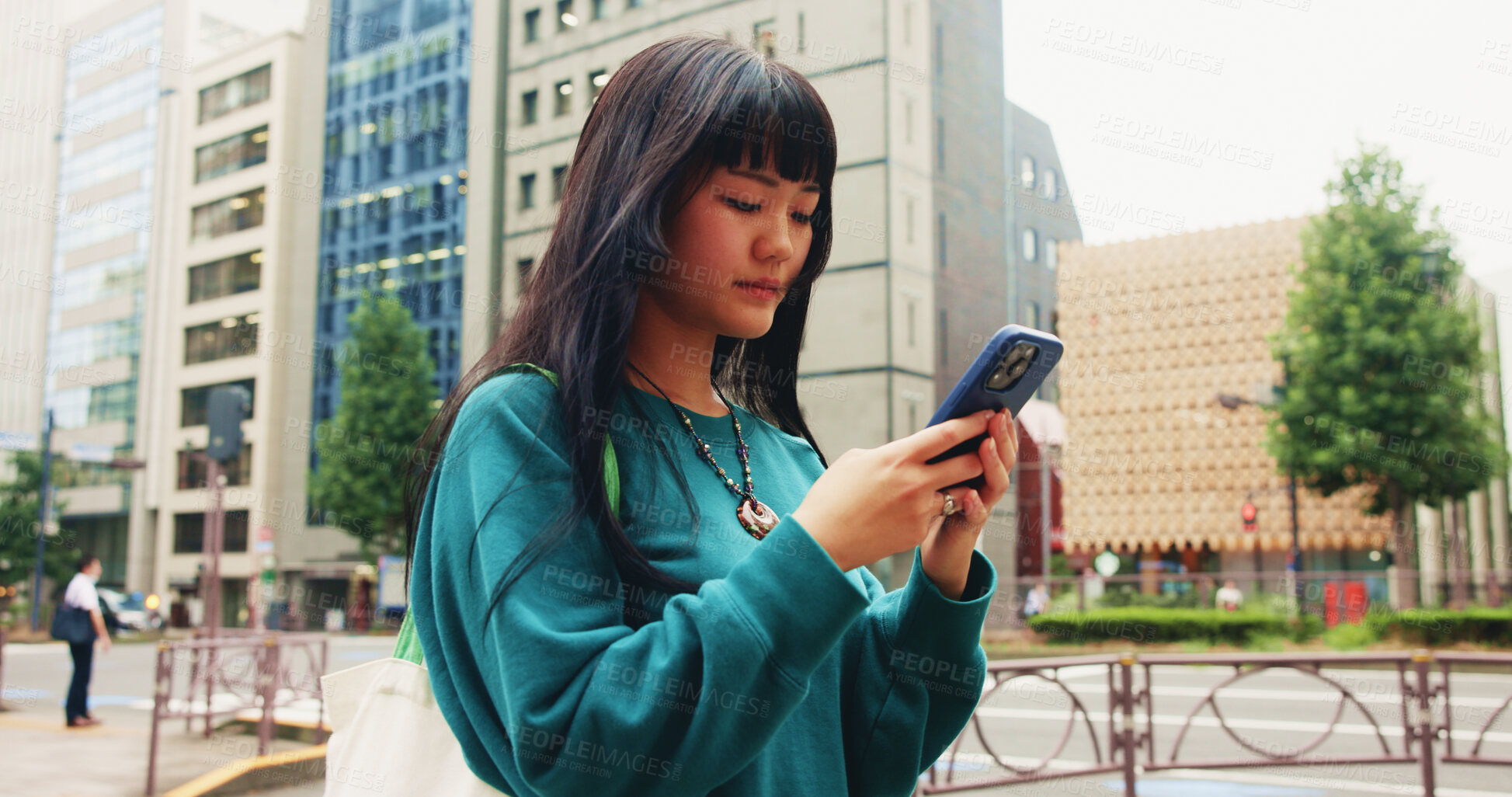 Buy stock photo Japanese, girl and typing with phone in city for communication, social media and chat notification. Woman, travel and mobile with navigation app of location, reading blog and website texting in Japan