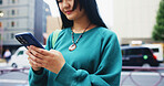 Japanese, woman and commute with phone in city for communication, social media and chat notification. Girl, travel and mobile for navigation app of location, reading blog and website texting in Japan