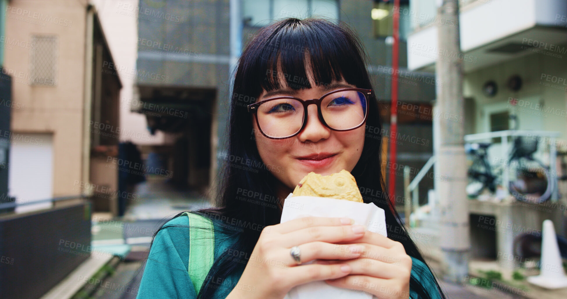 Buy stock photo Travel, eating and woman with pastry in city on vacation, adventure or weekend trip for journey. Happy, food and hungry Japanese female person enjoying Taiyaki for lunch in urban town on holiday.