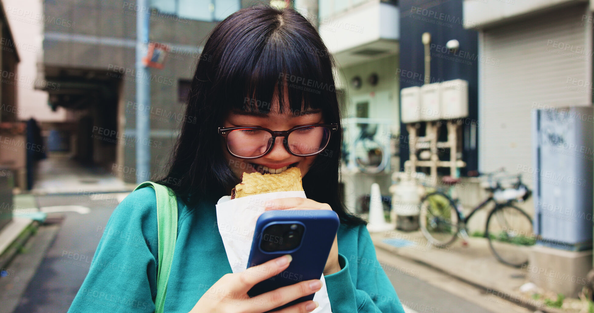 Buy stock photo Browsing, smile and woman with smartphone, snack and reading of timetable for exam, eating and campus. Outdoor, education and Asian person with food, scroll and check of schedule, mobile and Japan