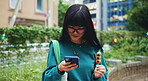 Student, online and woman with smartphone, eating and browsing of timetable for exam, food and campus. Outdoor, education and Asian person with snack, scroll and check of schedule, mobile and Japan