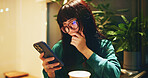 Japanese, woman and thinking with phone at cafe of  communication, social media and chat notification. Girl, glasses and mobile for coffee, texting contact and reading blog of dating website in Japan