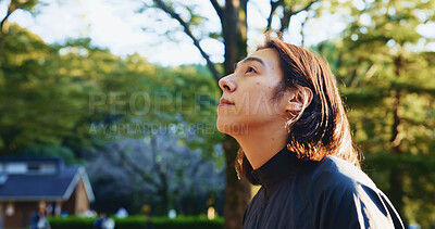 Buy stock photo Japanese man, thinking and walking for commute, travel or wondering with thoughtful mind outdoor. Male person, vision and planning in city for morning journey, explore or weekend tourist with idea