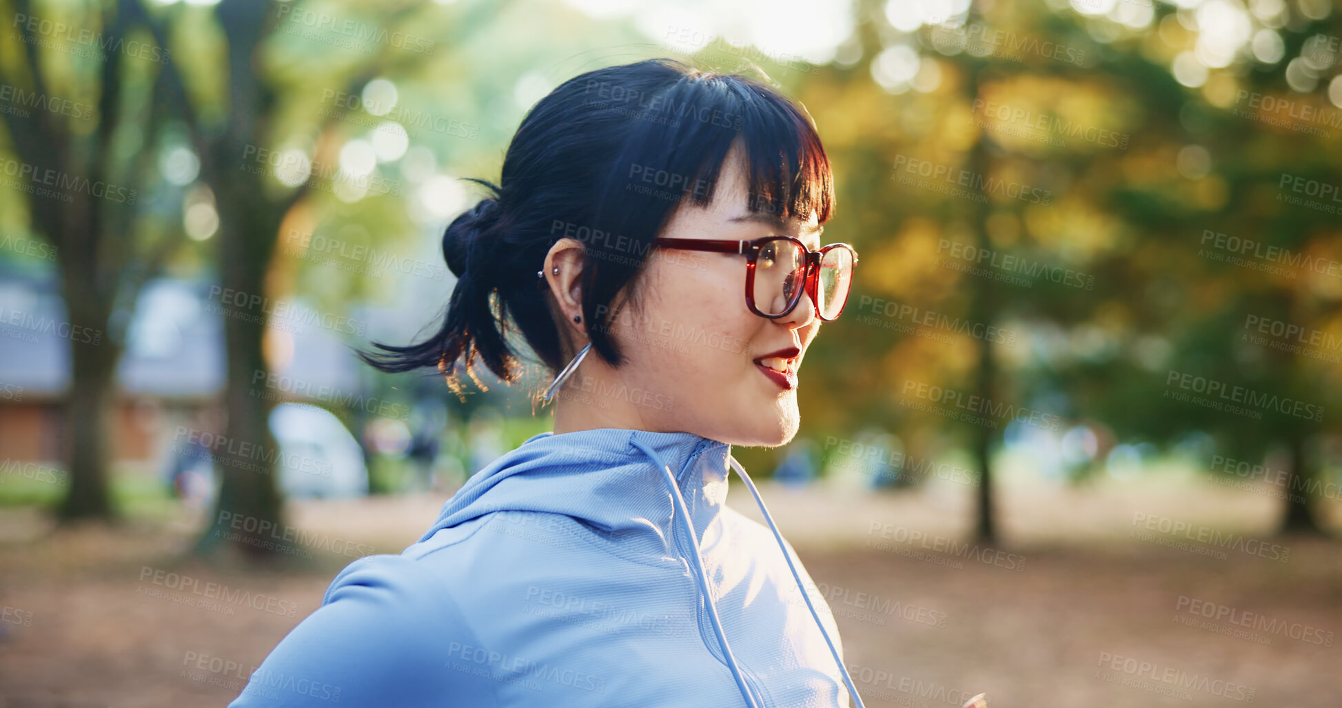 Buy stock photo Japan, runner and woman in park, fitness and smile with nature, wellness and training routine. Asian person, girl and athlete with glasses, outdoor and exercise with challenge, endurance and healthy