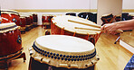 Japanese, drums or hands of person in practice for music on instrument for stage performance, creativity or talent. Taiko, stick or drummer in studio to play in rehearsal for culture, rhythm and beat