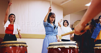 Buy stock photo Japanese, drums and people learning music on instrument for stage practice, creative performance or talent. Taiko, women and female drummers in band to play in rehearsal for culture, rhythm or beat