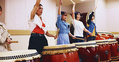 Buy stock photo Japanese, drums and women in performance for music on instrument for stage practice, creativity or talent. Taiko, people and female drummers in band to play in rehearsal for culture, rhythm or beat