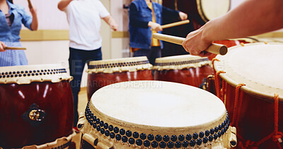Buy stock photo Japanese drums, hands and people with sticks on instrument for stage practice, performance or talent. Taiko, class and drummers in band to play in rehearsal for culture, song rhythm or creative beat