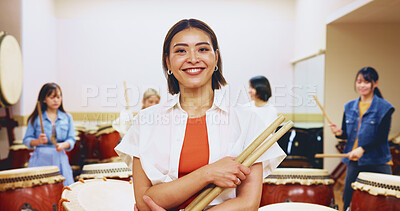 Buy stock photo Portrait, happy and woman with drum sticks of teaching music, community practice and art performance. Teacher, arms crossed and instrument for festival band, musician session and team talent in Japan