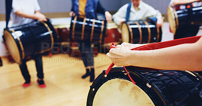 Buy stock photo People, hands and drum in studio for music, rehearsal and traditional rhythm in Japan. Taiko, musician group and practice in academy class for learning culture, heritage appreciation or demonstration