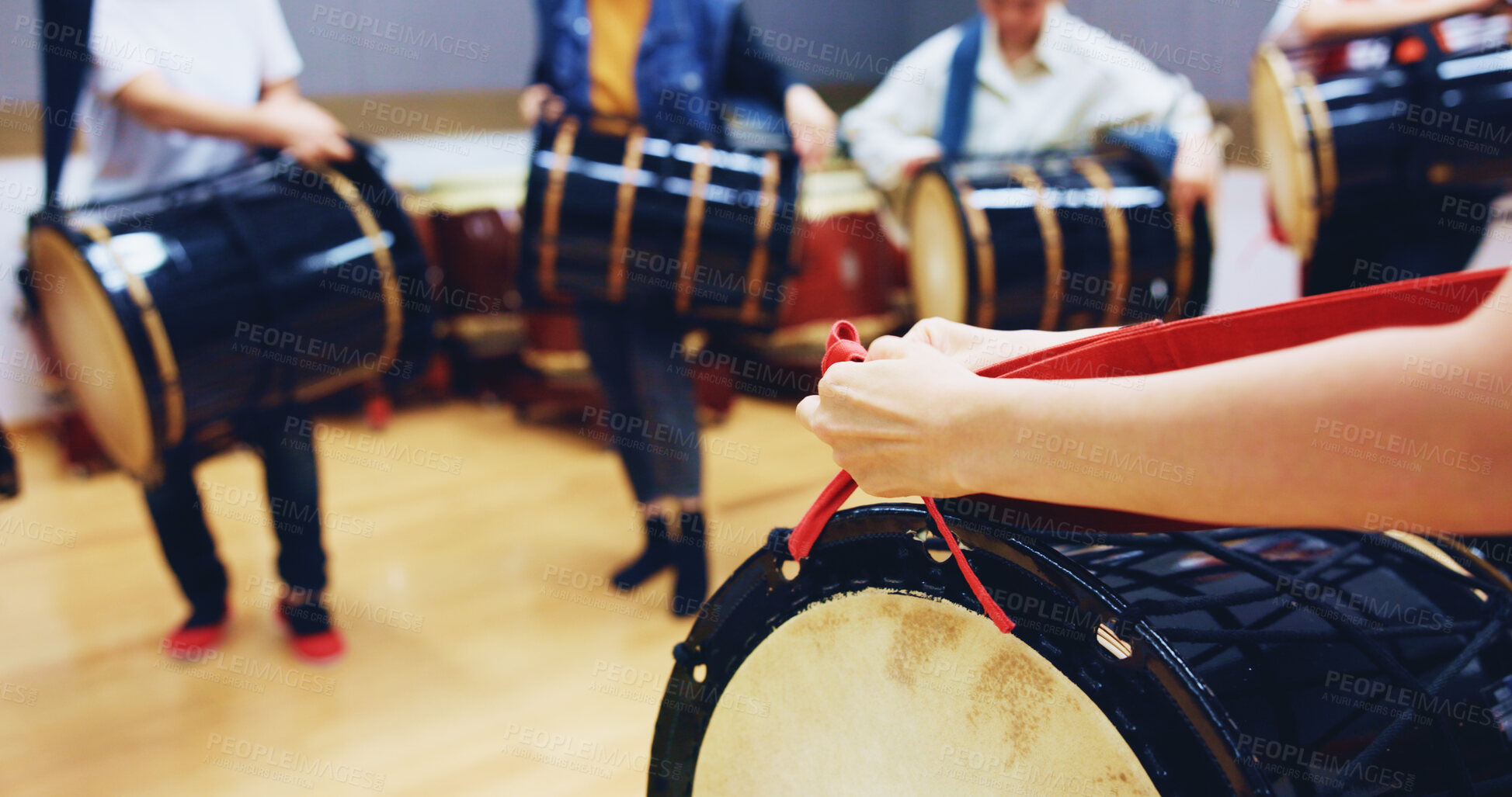 Buy stock photo People, hands and drum in studio for music, rehearsal and traditional rhythm in Japan. Taiko, musician group and practice in academy class for learning culture, heritage appreciation or demonstration