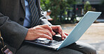 City, hands and laptop with business person outdoor for commute, remote work or travel closeup. Computer, email and typing with corporate employee in Japan for information, reading or research