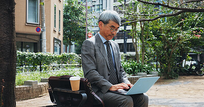 Buy stock photo Outdoor, businessman and research on laptop in city for email marketing and communication as lawyer in Japan. Mature person, employee and serious in downtown Tokyo for policy or legal document update