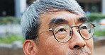 Japanese, corporate and man for thinking in city with glasses, travel decision and closeup reflection. Mature lawyer, thoughts and ideas for morning commute, location and justice opportunity in Japan