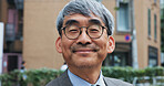 Business, city and portrait of mature man outdoor in Japan for morning commute or travel to work. About us, glasses and smile with face of happy Japanese in urban town for break from corporate career
