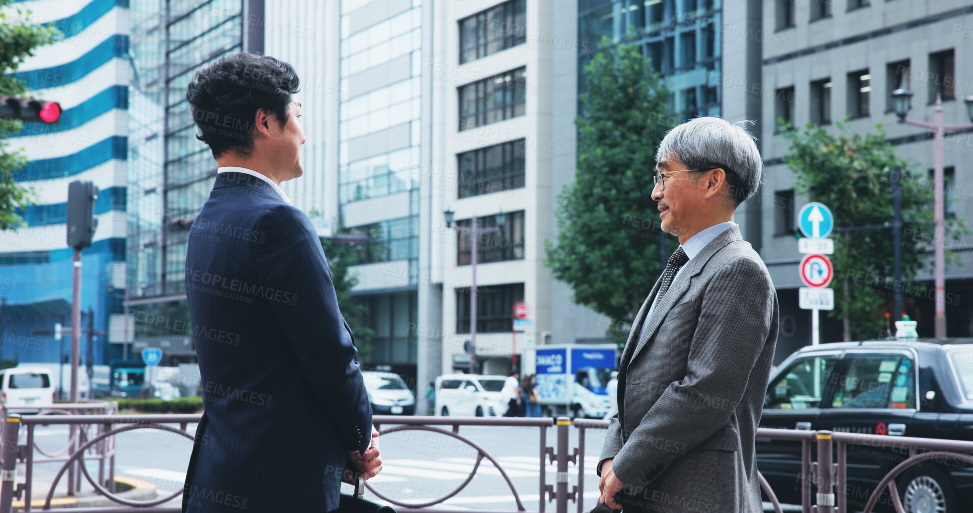 Buy stock photo Outdoor, businessmen and conversation at sidewalk in city for commuting and traveling to office in Japan. Partners, corporate people and discussion as entrepreneur with teamwork or collaboration