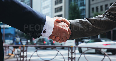 Buy stock photo Handshake, business people and men in city, partnership and agreement with b2b deal. Japan, closeup and employees in street, cooperation and negotiation with contract, collaboration and opportunity