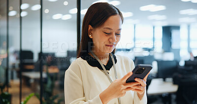 Buy stock photo Cellphone, typing and businesswoman in office with email, networking or communication for investment. Technology, contact and Japanese female financial planner with phone for online finance report.