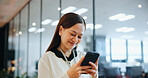 Cellphone, happy and businesswoman in office with email, networking or communication for investment. Technology, contact and Japanese female financial planner with phone for online finance report.
