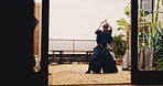 Dojo, sword and training with Samurai man in Japan for fighting, martial arts or Kenjutsu, Combat, culture and weapon with Japanese person in kendogi for discipline, exercise or practice routine