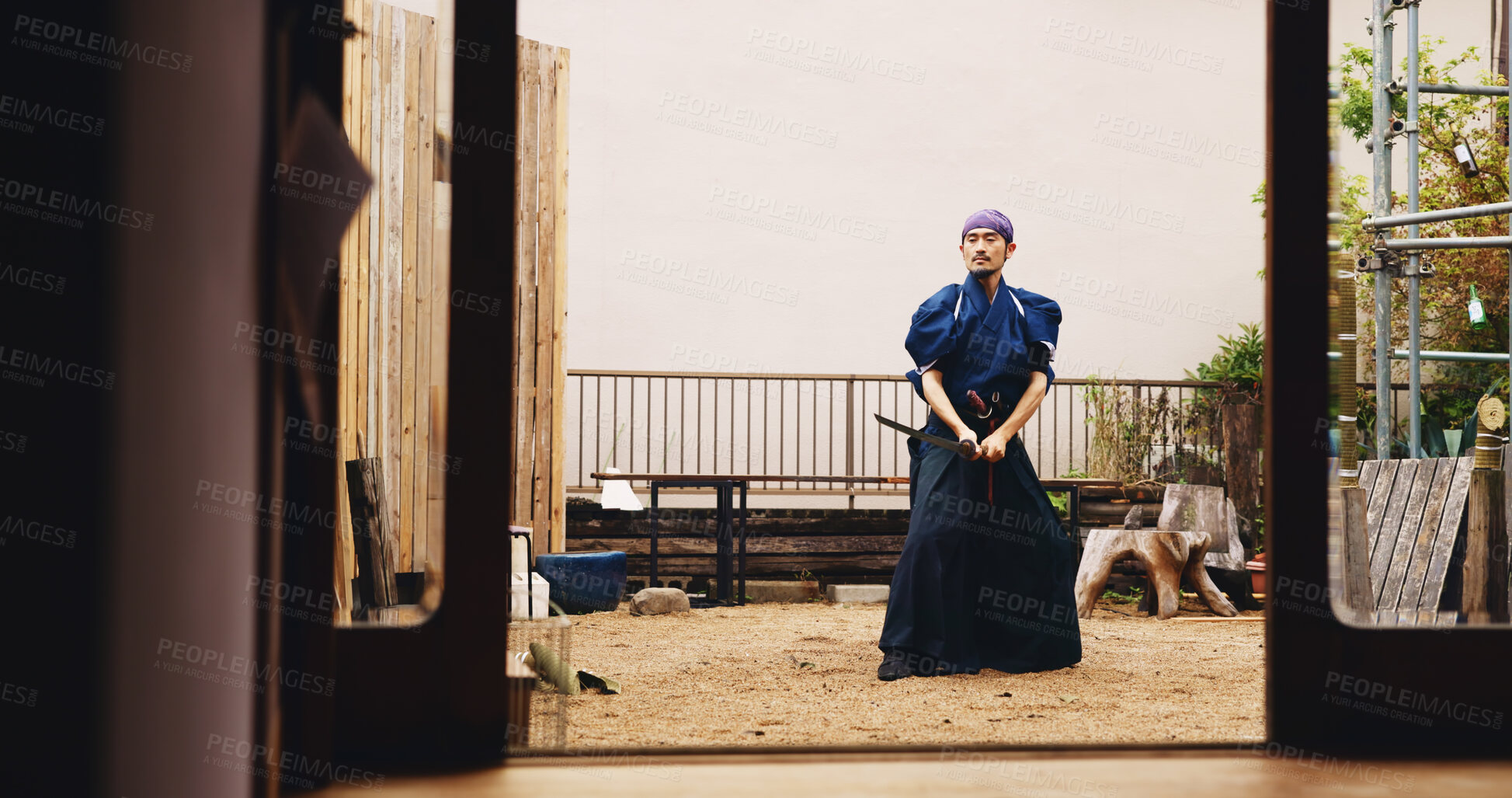 Buy stock photo Dojo, fighting and sword with Samurai man in Japan for culture, martial arts or training, Combat, Kenjutsu and weapon with Japanese person in kendogi for discipline, exercise or practice routine
