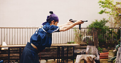 Buy stock photo Dojo, loyalty and sword with Samurai man in Japan for combat, martial arts or training, Allegiance, fealty and honor with Japanese person in kendogi for discipline, exercise or practice routine