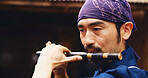 Japanese man, flute and music for tradition, performance and zen sound for Shinto meditation. Sensei person, bamboo and fue instrument for practice, culture and spiritual heritage with Ryeteki