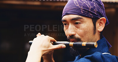 Buy stock photo Japanese man, flute and music for tradition, performance and zen sound for Shinto meditation. Sensei person, bamboo and fue instrument for practice, culture and spiritual heritage with Ryeteki