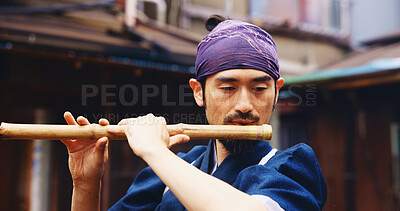 Buy stock photo Japanese man, flute and music for practice, performance and zen sound for Shinto meditation. Sensei person, bamboo and fue instrument for tradition, culture and spiritual heritage with shinobue