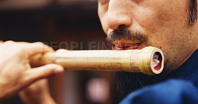 Buy stock photo Japanese man, mouth and music for flute practice, performance and zen sound for Shinto meditation. Sensei person, bamboo and fue instrument for tradition, culture and spiritual heritage with shinobue