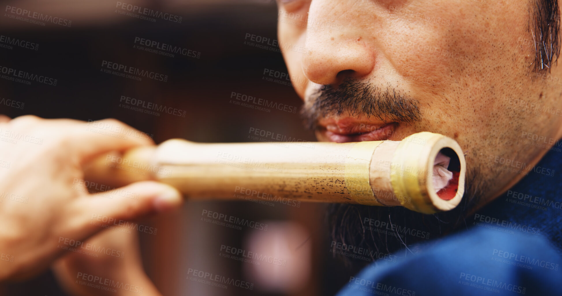 Buy stock photo Japanese man, mouth and music for flute practice, performance and zen sound for Shinto meditation. Sensei person, bamboo and fue instrument for tradition, culture and spiritual heritage with shinobue