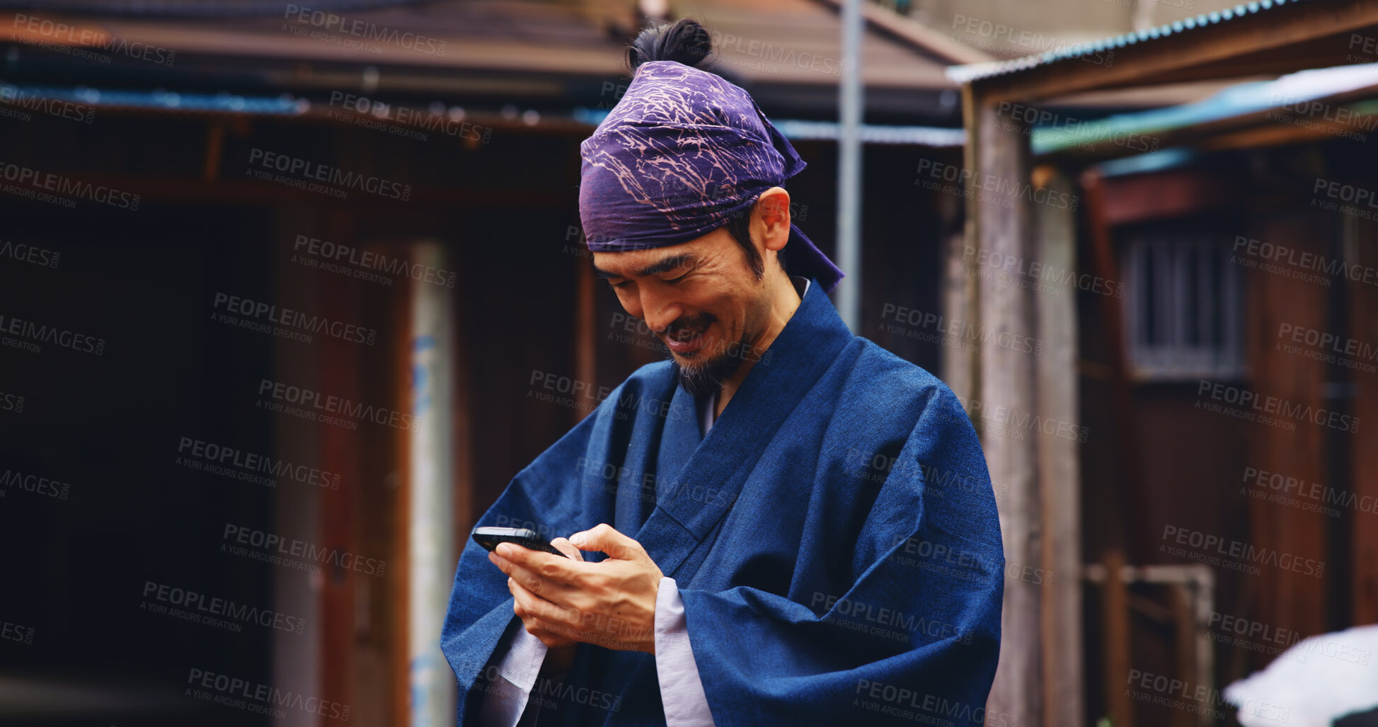 Buy stock photo Japan, outdoor and man with smartphone, typing and smile with network, happiness and social media. Asian person, kimono and guy with cellphone, internet and connection with message to contact and app