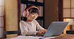 Elearning, typing and child with laptop, headphones and education for girl, listening or studying. Home, happy and online and practice for exam, audio and podcast for knowledge, smile or kid in Japan