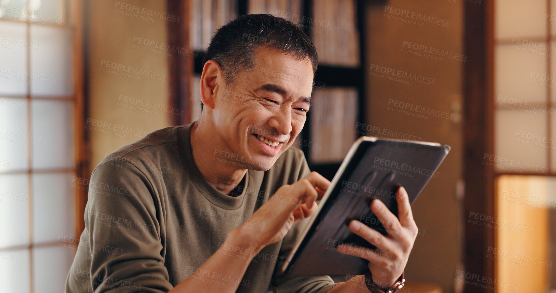 Buy stock photo Tablet, writer or happy Asian man in home office reading for remote work, research or website. Joke, mature author or creative freelancer online for campaign, article ideas and funny meme in Japan