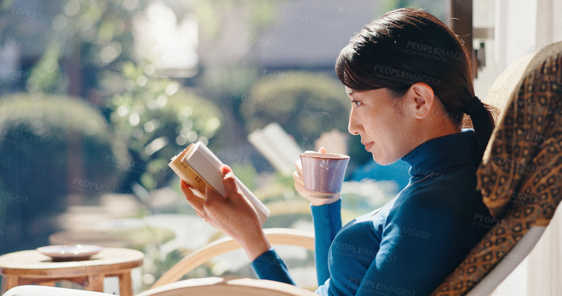 Buy stock photo Reading, relax and Asian woman with book, morning and knowledge with literature, coffee and weekend. Home, tea and person with novel, rest and comfortable with story, break and cozy on chair or Japan