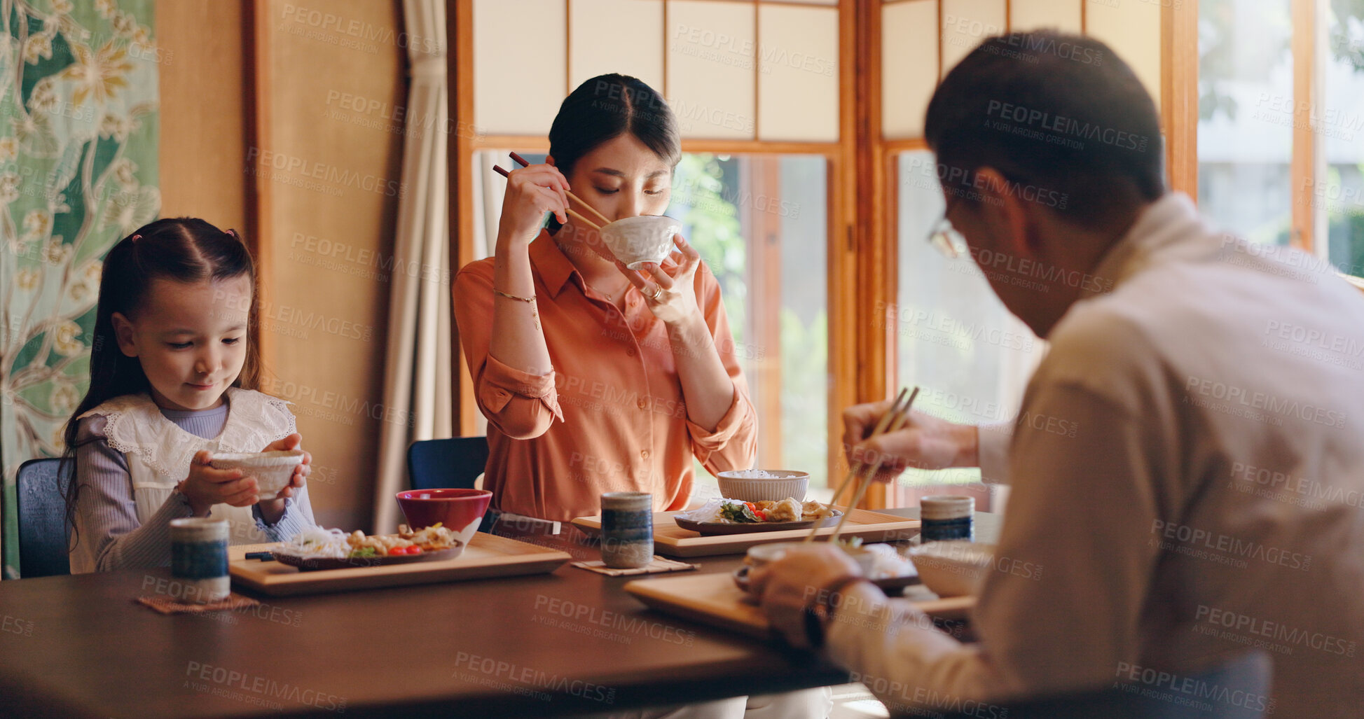 Buy stock photo Japan, house and family with food, girl and parents with healthy meal, protein and lunch. Apartment, mother and father with daughter, Asian cuisine and wellness with nutrition, eating and traditional