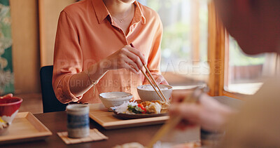Buy stock photo Family, food or eating with chopsticks at dinner table for meal, snack or cuisine at home. Japan, hands and people tasting ingredients with utensils for dining culture, tradition or heritage at house