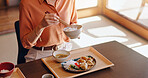 Woman, hands or eating rice with chopsticks at dinner table for meal, snack or cuisine at home. Closeup, Japan or female person tasting with bowl or utensils for dining culture, tradition or heritage