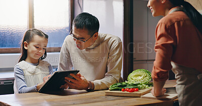 Buy stock photo Parents, girl and tablet in kitchen with cooking, learning and happy with streaming, tutorial or recipe in family home. People, father and child on digital touchscreen for meal prep at house in Japan