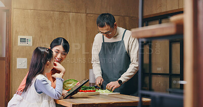 Buy stock photo Parents, girl and tablet in home with cooking, learning and happy with food, tutorial and recipe in kitchen. People, mother and daughter with dad, touchscreen and meal prep at family house in Japan