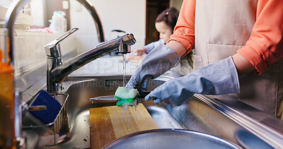 Buy stock photo Hands, girl and mom for washing dishes in home, learning and helping hand for hygiene in kitchen. People, mother and daughter with routine, teaching and cleaning for dirt at family house in Japan