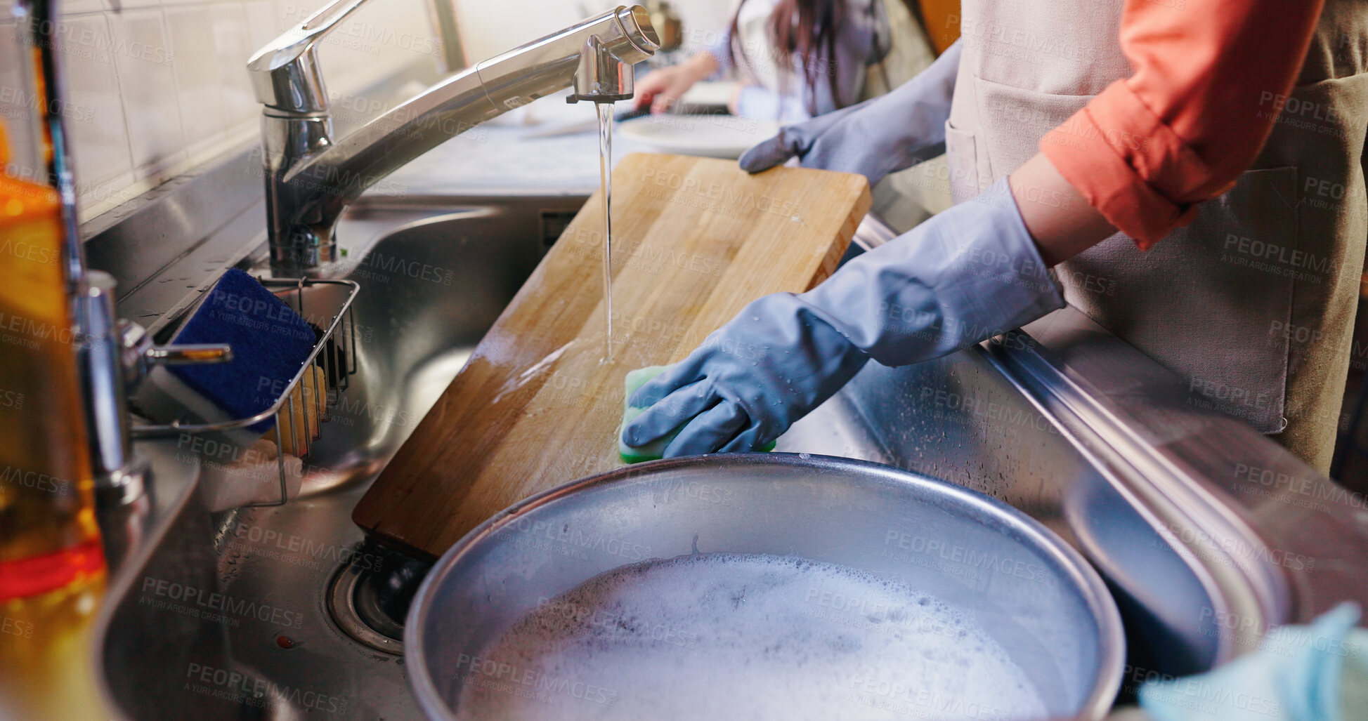 Buy stock photo Hands, girl and mom for washing dishes in kitchen, learning and helping with hygiene in apartment. People, mother and daughter with routine, teaching and cleaning with water at family house in Japan