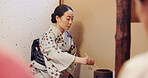 Japanese woman, tea ceremony and preparation for matcha drink, cultural hospitality or heritage in chashitsu. Traditional ritual, person and beverage process for guests with custom practice in kimono